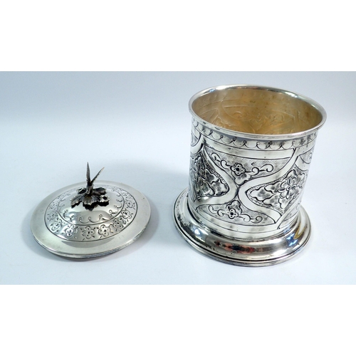 190 - A silver plated biscuit barrel with embossed decoration and bird finial 19cm tall