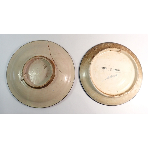 2 - Two early 20th century Spanish tin glazed chargers - one repaired, largest 35.5cm