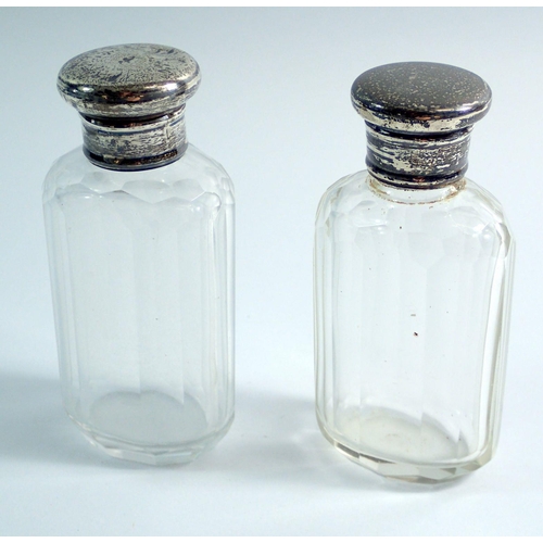 233 - Two silver topped cut glass toiletry bottles, 9cm, Birmingham 1915