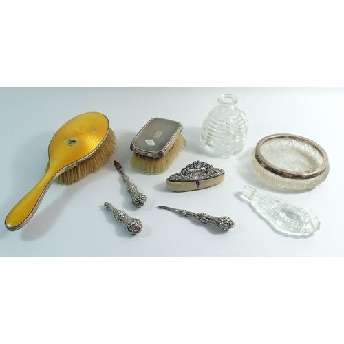 255 - A silver part manicure set, two brushes and silver rimmed dish plus glass scent bottle