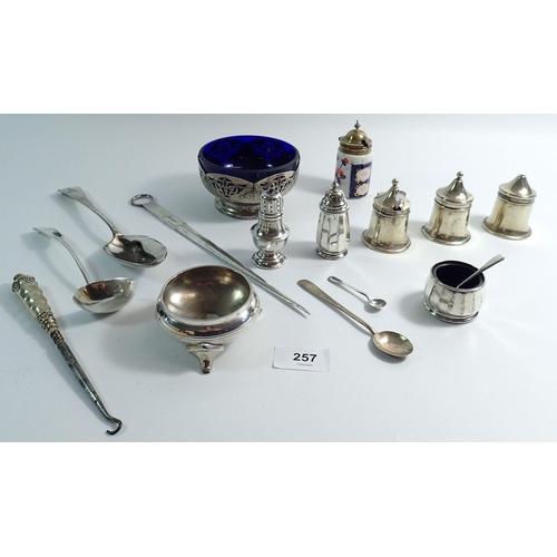 257 - A silver Adie Brothers pepper pot, two silver spoons and various silver plated cruets etc including ... 