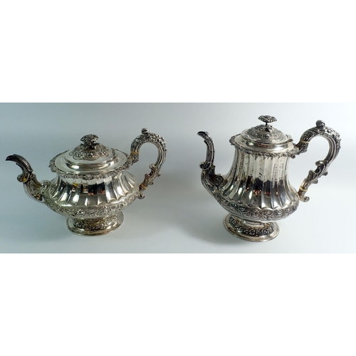 276 - A Georgian silver four piece tea service with rose finials and fluted body, with further floral band... 