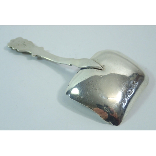 287 - A silver caddy spoon with foliate engraved rectangular bowl and fleur de lys handle, Birmingham 1835... 