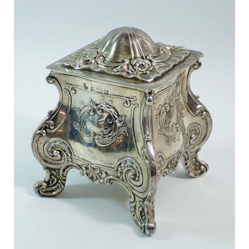 290 - A silver bombe form embossed tea caddy, 12cm tall, Birmingham 1910, makers mark rubbed, 303g