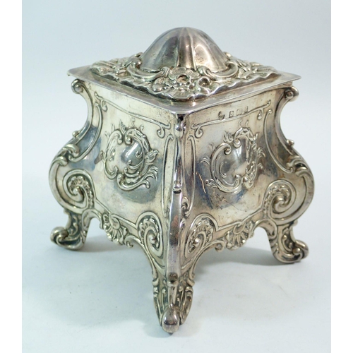 290 - A silver bombe form embossed tea caddy, 12cm tall, Birmingham 1910, makers mark rubbed, 303g