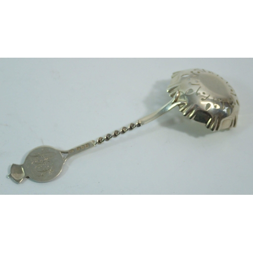 296 - A Queen Victoria silver gilt commemorative sugar sifter spoon decorated heads of Victoria and her ch... 