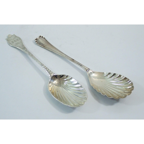 301 - Two silver serving spoons, one with shell bowl, Sheffield 1915 by Atkin Bros and one an early Georgi... 