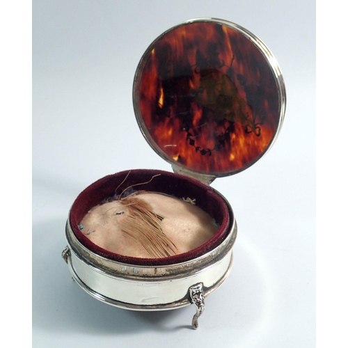 308 - A silver and tortoiseshell circular dressing table box, makers mark rubbed, Birmingham 1935, 9cm dia... 