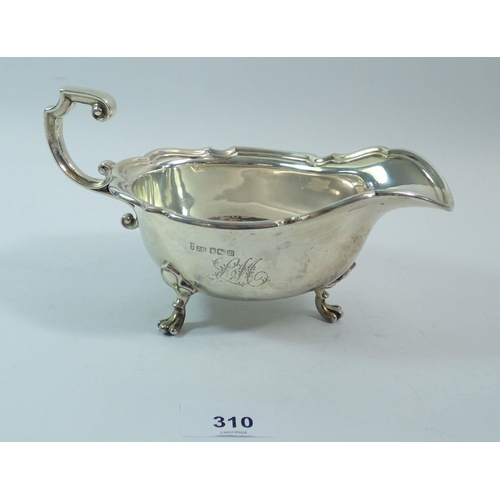 310 - A silver large sauce boat on three paw feet, 20cm, Sheffield 1904, Joseph Rodgers and Sons, 302.7g