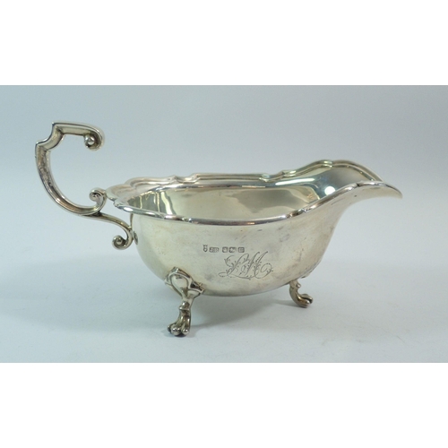 310 - A silver large sauce boat on three paw feet, 20cm, Sheffield 1904, Joseph Rodgers and Sons, 302.7g