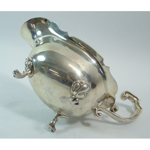 310 - A silver large sauce boat on three paw feet, 20cm, Sheffield 1904, Joseph Rodgers and Sons, 302.7g