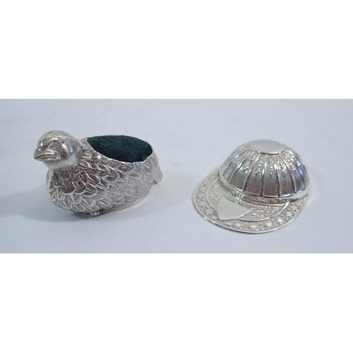 315 - A jockey cap silver caddy spoon, Sheffield 1991 and a chick pin cushion, 5cm