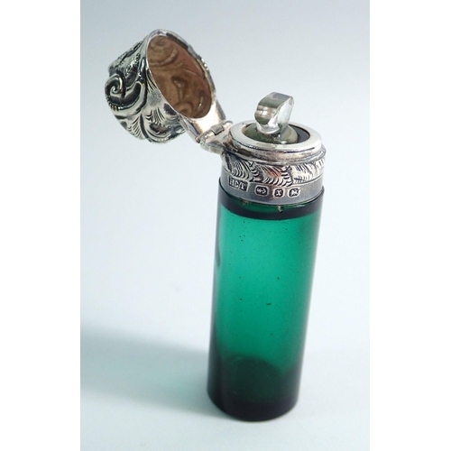 321 - A green glass scent bottle with silver mounts and floral embossed hinged lid, Birmingham 1897 by HCT... 