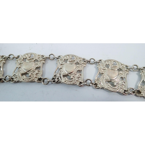 323 - An Edwardian Art Nouveau silver belt with scrollwork and heart motifs, 76cm long, E S Barnsley & Co.... 