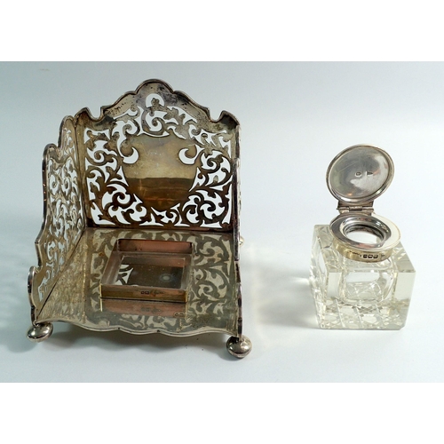 327 - A Walker & Hall silver inkwell with raised pierced and scrollwork back and sides, 10.5cm wide, Sheff... 