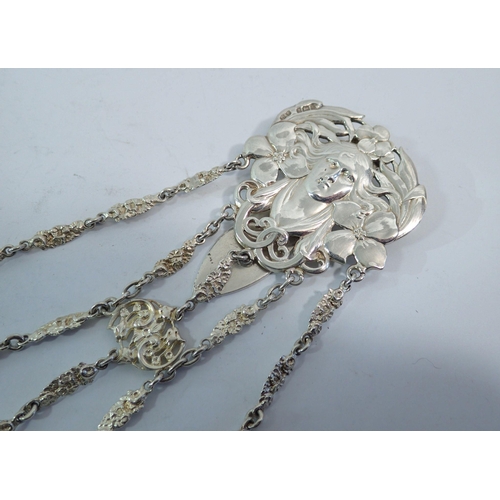 329 - A silver Art Nouveau chatelaine - the clip embossed female mask and flowers, Birmingham 1901 by Deak... 