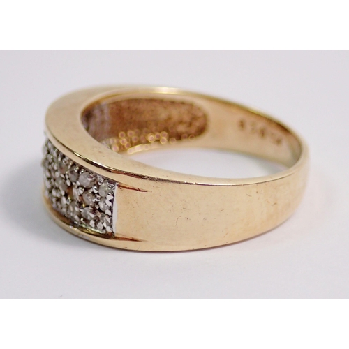 337 - A 9 carat gold ring inset three rows of diamonds, size K to L, 3g