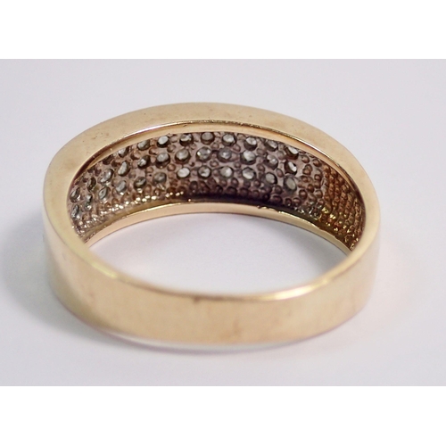 337 - A 9 carat gold ring inset three rows of diamonds, size K to L, 3g