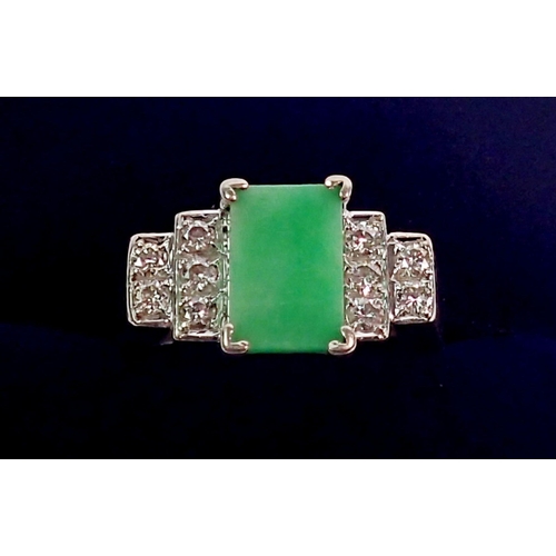 351 - A Chinese Art Deco style white metal ring set jade plaque flanked by ten stepped diamonds, size N, C... 