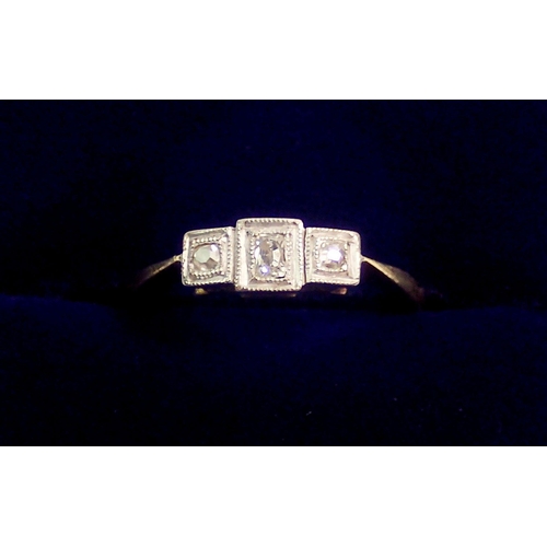 352 - An Art Deco 18 carat gold three stone diamond ring with square settings, size L. 2.5g - in original ... 