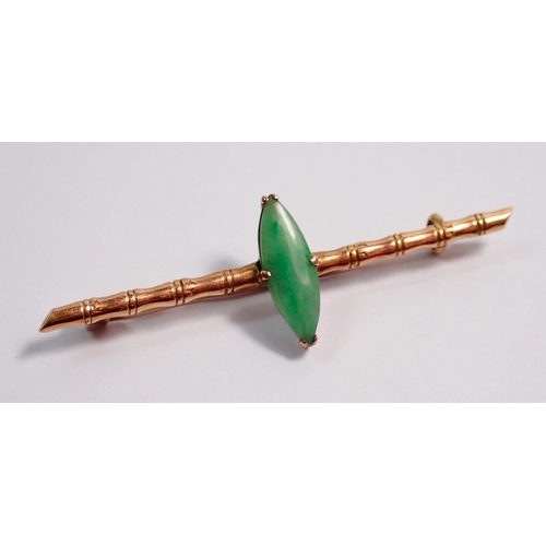 354 - A Chinese 18 carat gold bamboo bar brooch set marquise cut jade, 5.5cm wide, jade 1.5 x 0.5cm, 2.8g