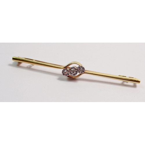 360 - A 15 carat gold bar brooch set three diamonds, 5.5cm long, 3.3g