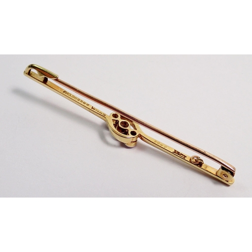 360 - A 15 carat gold bar brooch set three diamonds, 5.5cm long, 3.3g