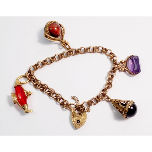 363 - A 9 carat gold charm bracelet with two stone set fob charms and two other charms, 29g