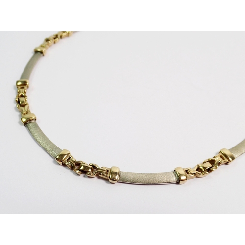 383 - A 9 carat yellow and white gold necklace by Crouch The Goldsmiths, 42cm long - boxed, 21.5g oed