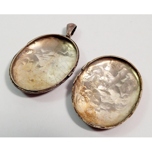 401 - A Victorian silver large oval locket engraved leaves, 5 x 4cm