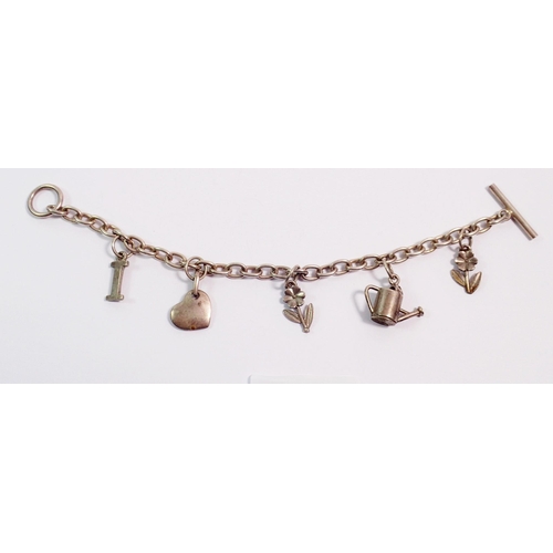 415 - A silver charm bracelet with watering can, heart and flower charms etc, 26g