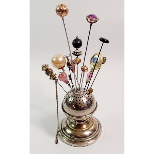 420 - A collection of hat pins in silver plated spherical stand including 9ct gold and turquoise