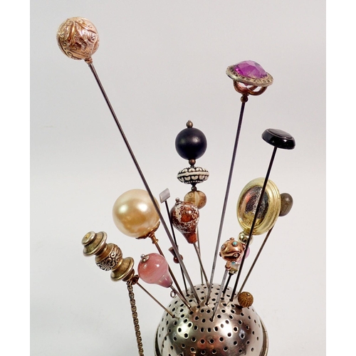 420 - A collection of hat pins in silver plated spherical stand including 9ct gold and turquoise