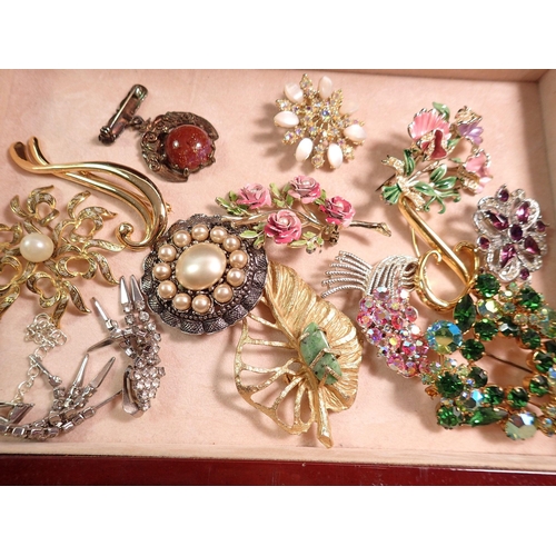 445 - A jewellery box with contents including earrings, brooches, bracelets etc