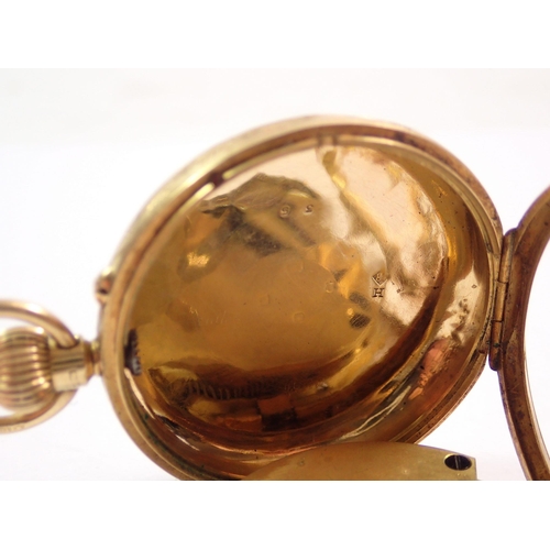 452 - A 19th century 18 carat gold pocket watch with engraved decoration, 43g total weight, 4cm diameter