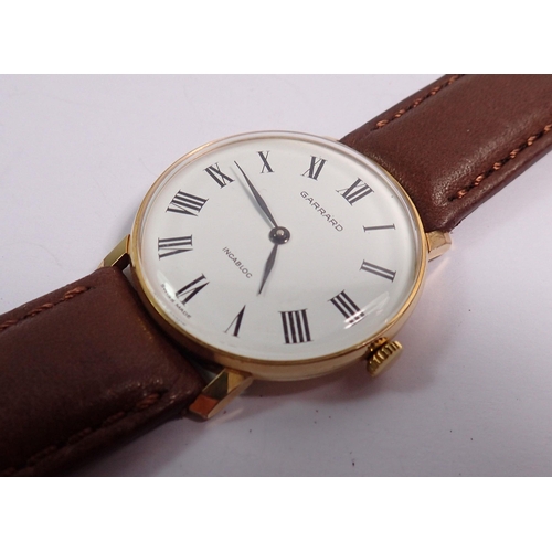 462 - A Garrard Incabloc vintage gentleman's gold plated watch on leather strap