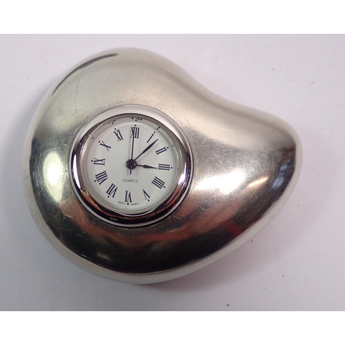 471 - A pewter cased pebble pocket watch by Fleur Grenier 5.7cm wide