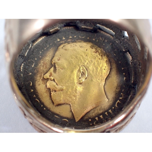 490 - A George V 1911 gold sovereign mounted 9 carat gold ring, size T, total weight 15.2g