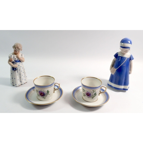 51 - Two Copenhagen figures of girls, tallest 17cm and a pair of cabinet cups painted flowers