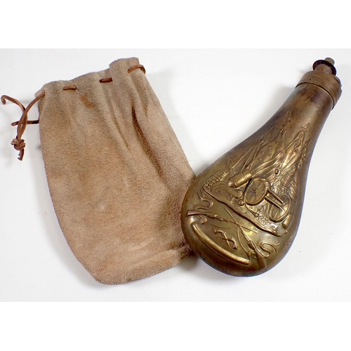 611 - A 19th century brass powder flask embossed war trophies