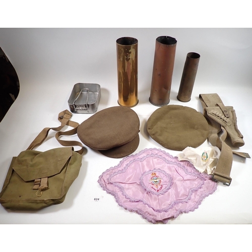 624 - A collection of military items including two brass shell cases, one dated 1916, army hats etc.