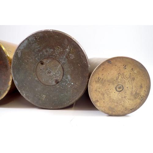 624 - A collection of military items including two brass shell cases, one dated 1916, army hats etc.