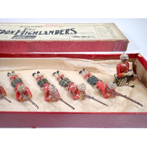 693 - A Britains boxed military set, The Gordon Highlander No 118, nine firing lying down and one kneeling