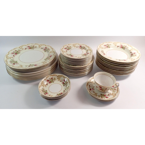 70 - A Japanese floral printed part dinner service comprising: four small bowls, four dinner plates, eigh... 