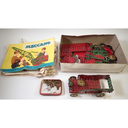 712 - A box of Meccano and instructions