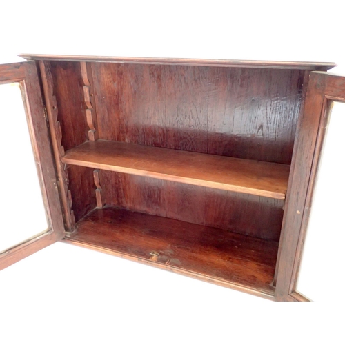 992 - An Edwardian mahogany small table top glazed cupboard, 79.5cm wide