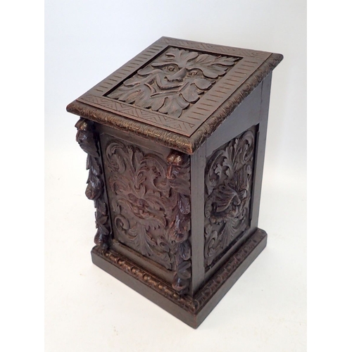 994 - A Victorian carved oak log box made from 17th century panels with mask and foliage decoration, 54cm ... 