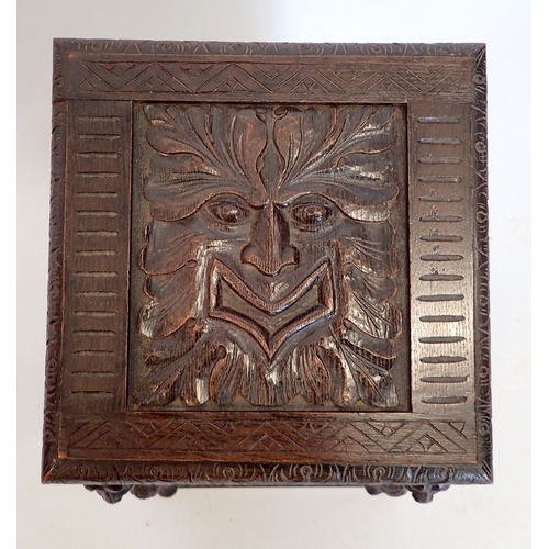 994 - A Victorian carved oak log box made from 17th century panels with mask and foliage decoration, 54cm ... 