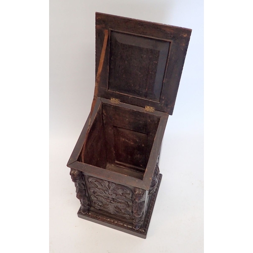 994 - A Victorian carved oak log box made from 17th century panels with mask and foliage decoration, 54cm ... 