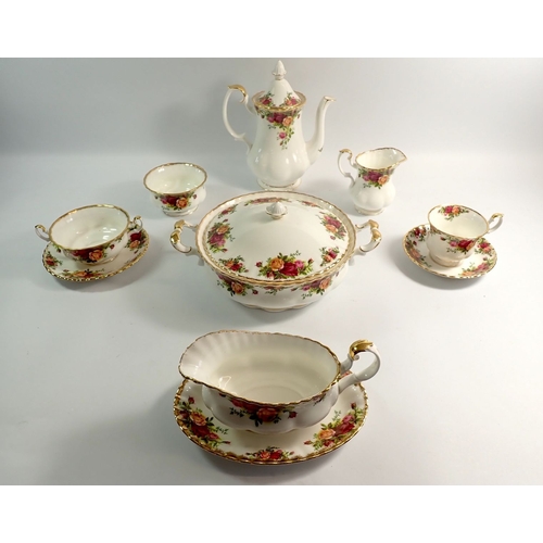 2 - A Royal Albert Country Roses dinner service comprising coffee pot, milk and sugar, six cups and sauc... 